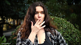 Sweet and Busty Russian Babe Smoking Cigarette in Nature