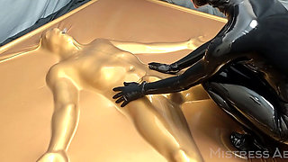 Latex Lovers Encased in Gold