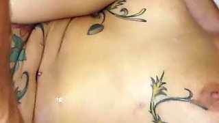 Stunning inked babe gets fucked on the bed