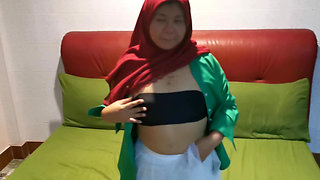 Hijab girl plucks under a white skirt