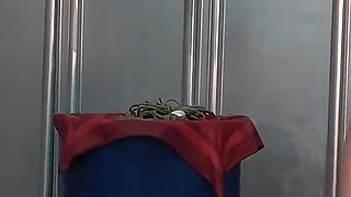 Mistress Whips Male Masochist Who Is Holding Dildo in His Mouth to Prevent It From Falling Out of Female Masochist Pussy