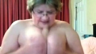 Big-Titted Granny Pleasures Herself with a Sex Toy on Webcam