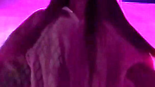 Smoking a Cigarette Outdoor While Wearing Only a Bikini and a Jacket