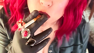 Your Mistress Tina Snua dressed In Leather Chain Smoking 2 Cork Cigarettes