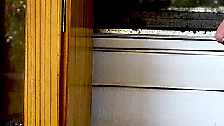 Shaved Head Goth Smokes Outside