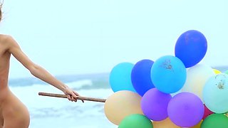 Sexy naked MILF playing with her baloons