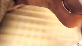 Brunette with foot fetish rubs big dick with her feet in POV