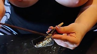 Big tit step mom rolls a joint with her tits out