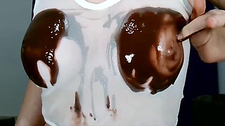 Wetting boobs, tities and nipples with chocolate
